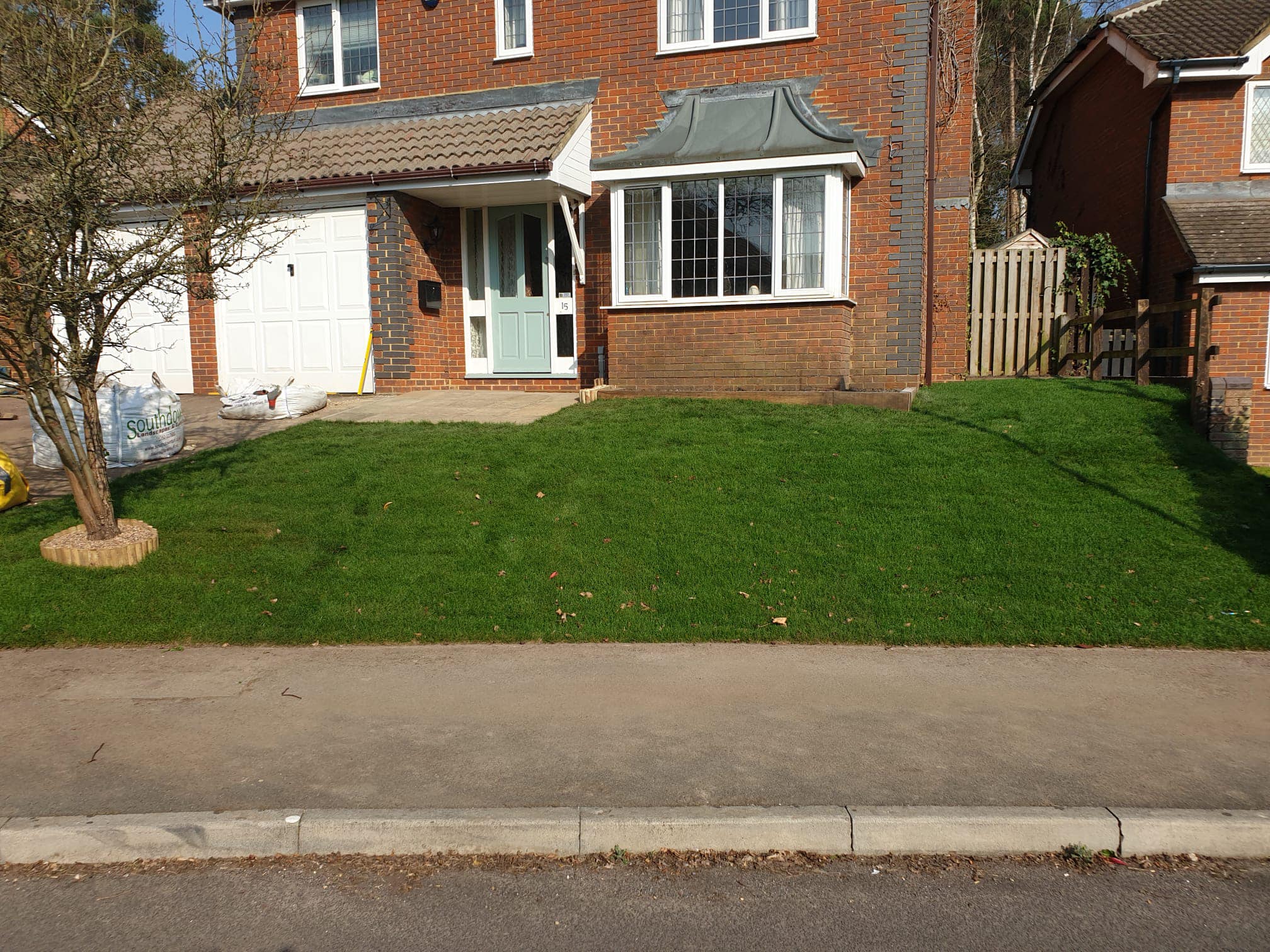 Newly turfed front garden after ground clearance in Farnham
